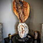 Golden Aragonite sculpture on Brazilian Agate base carved by Stone Art Studios.