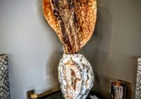 Golden Aragonite sculpture on Brazilian Agate base carved by Stone Art Studios.